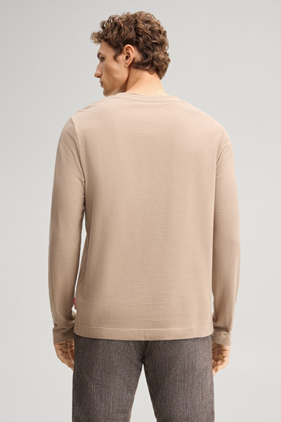 Leads to product detail page "Brown cotton longsleeve top"