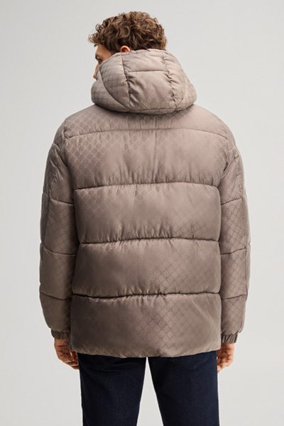Leads to product detail page "Cornflower-patterned quilted jacket in taupe"