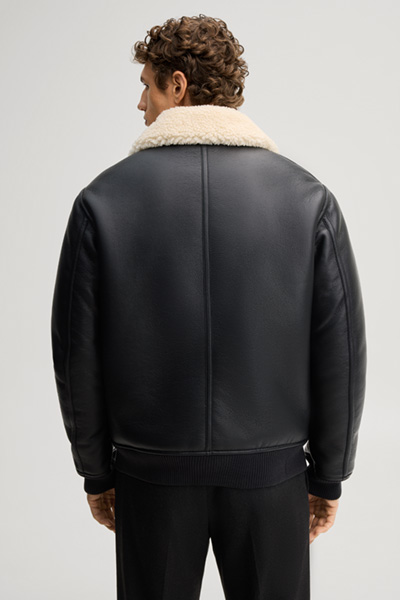 Leads to product detail page "Black vegan leather blouson"
