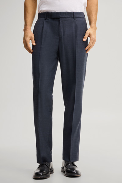 Leads to product detail page "Modular trousers in navy, made from virgin wool"