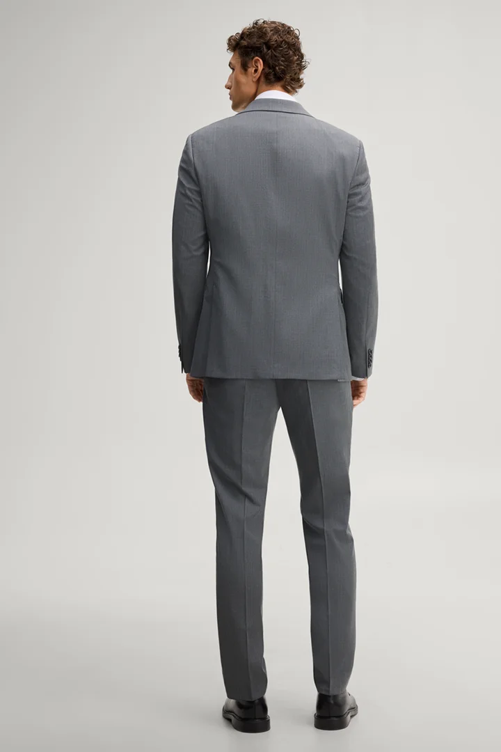 Leads to product detail page "Anthracite-coloured wool-blend suit"
