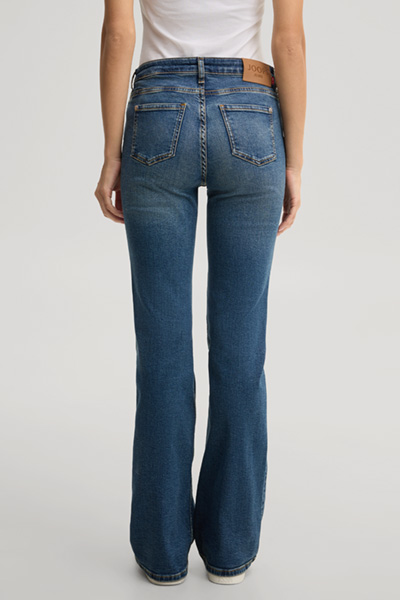 Leads to product detail page "Blue washed bootcut jeans"