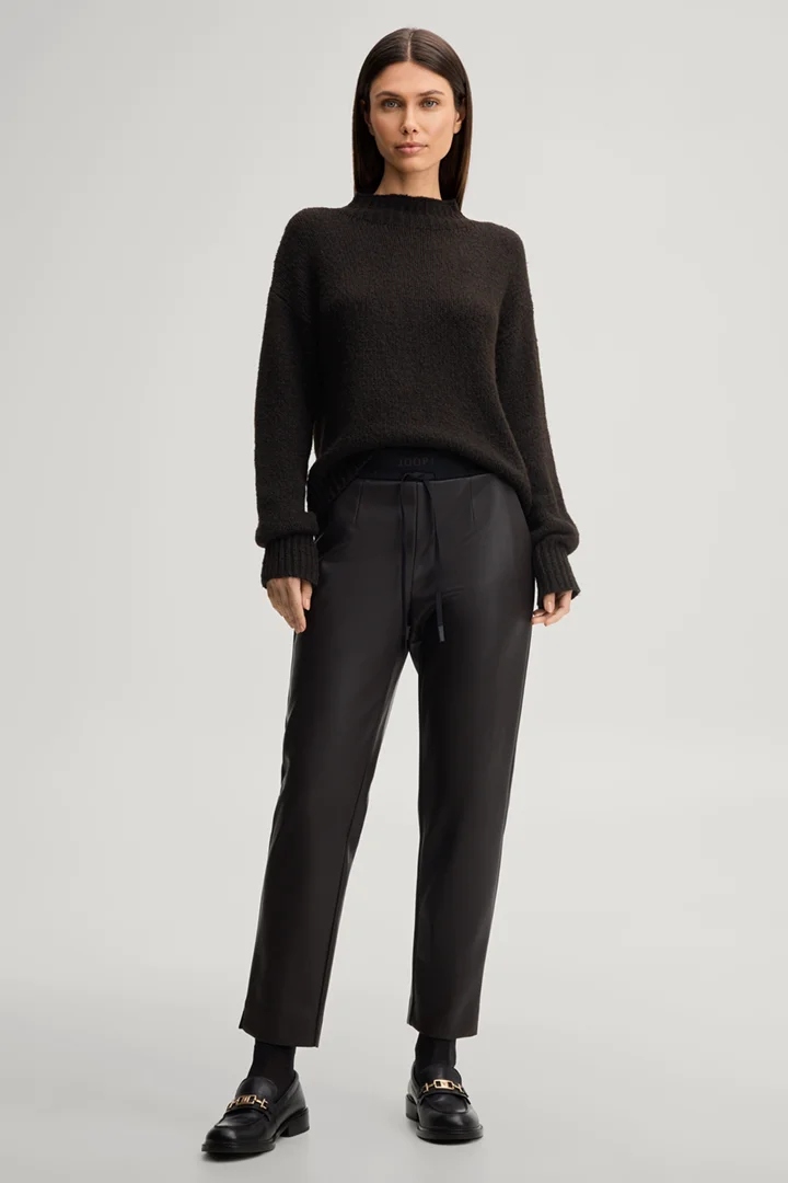 Leads to product detail page "Faux leather cigarette trousers in dark brown"