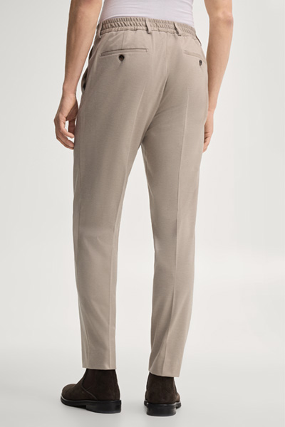 Leads to product detail page "Modular trousers in beige"