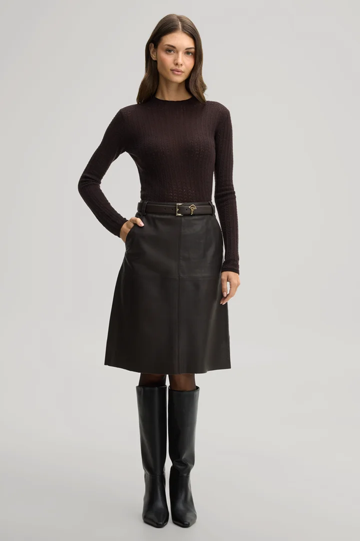 Leads to product detail page "Dark brown woollen jumper with a stand-up collar"