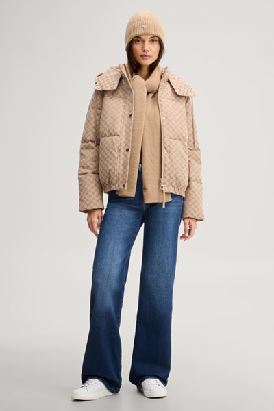 Leads to product detail page "Cornflower jacquard quilted jacket with a camel and dark brown pattern"