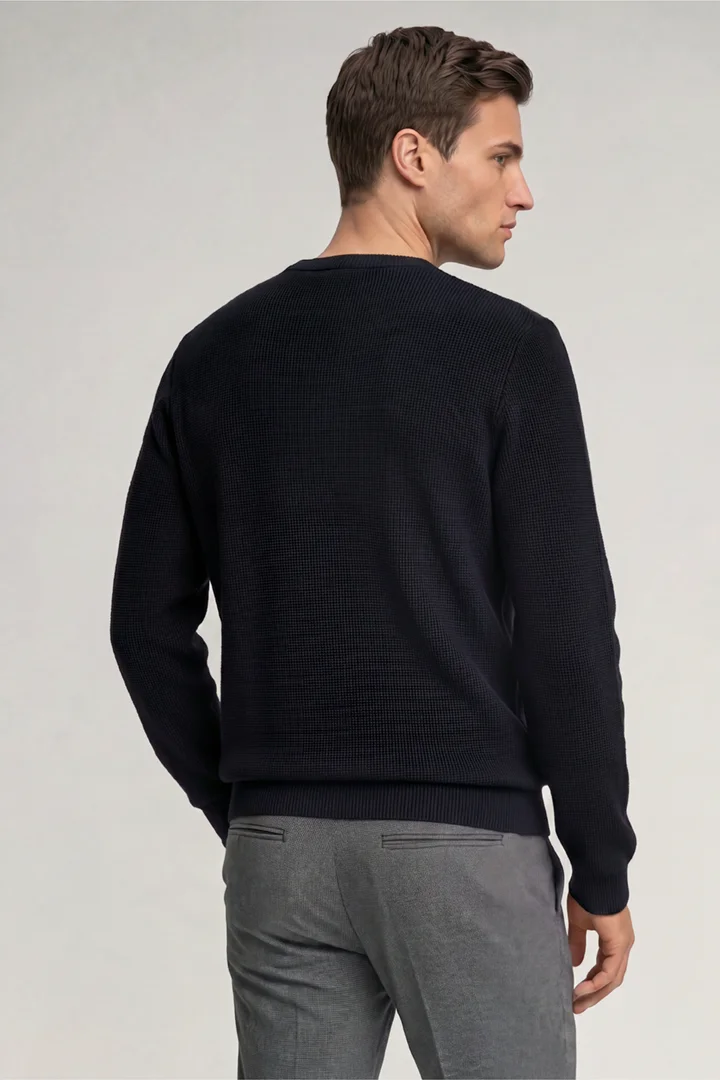 Leads to product detail page "Dark blue crew-neck jumper"
