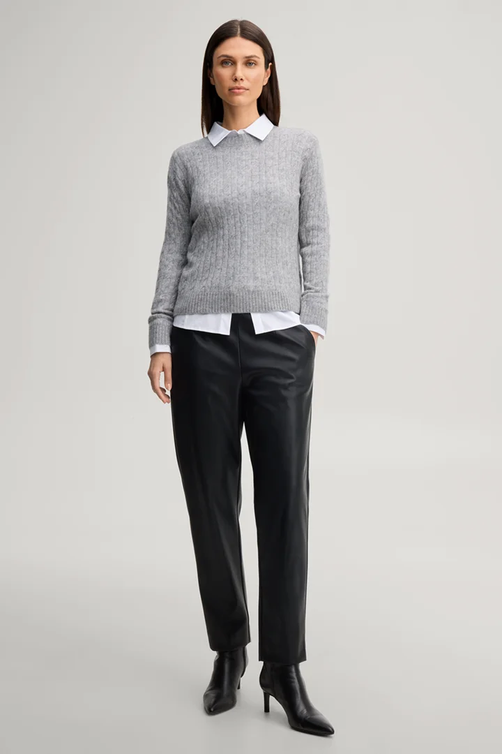 Leads to product detail page "Faux leather cigarette trousers in black"