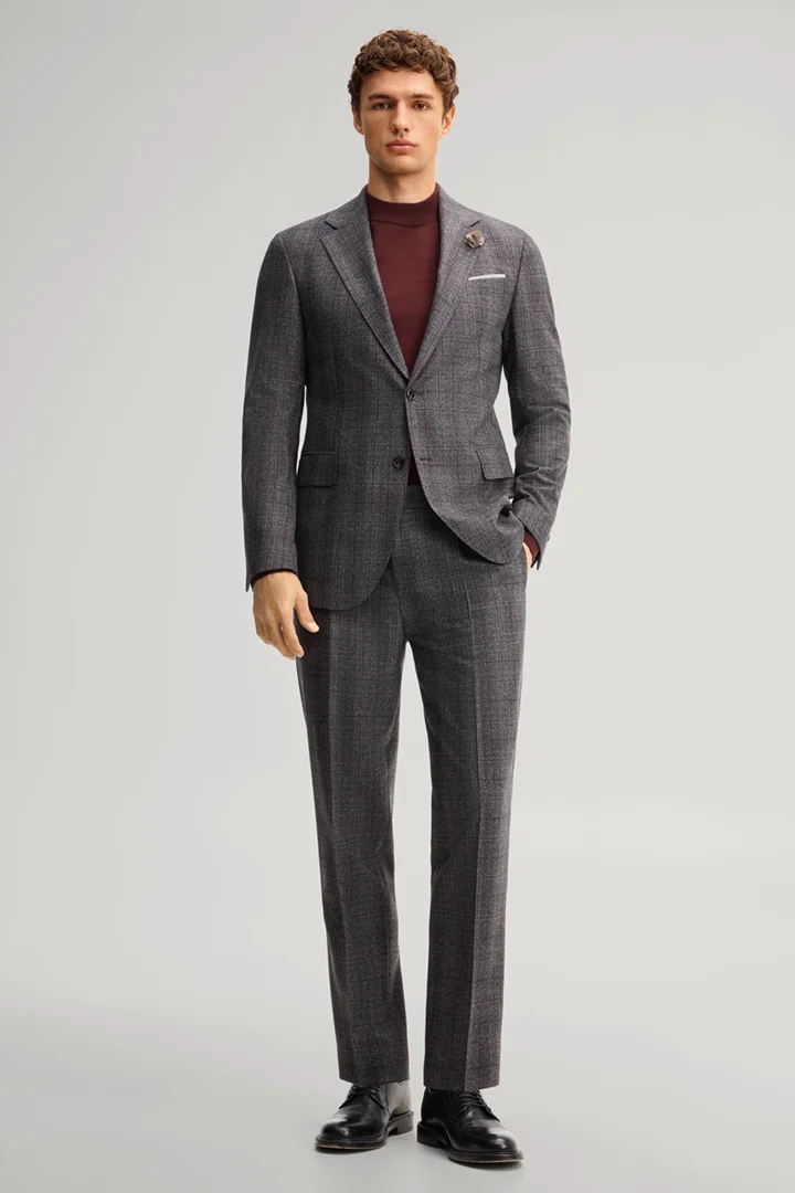 Leads to product detail page "A suit made from virgin wool in an anthracite chequered pattern"