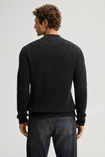Leads to product detail page "Dark green jumper with a stand-up collar"