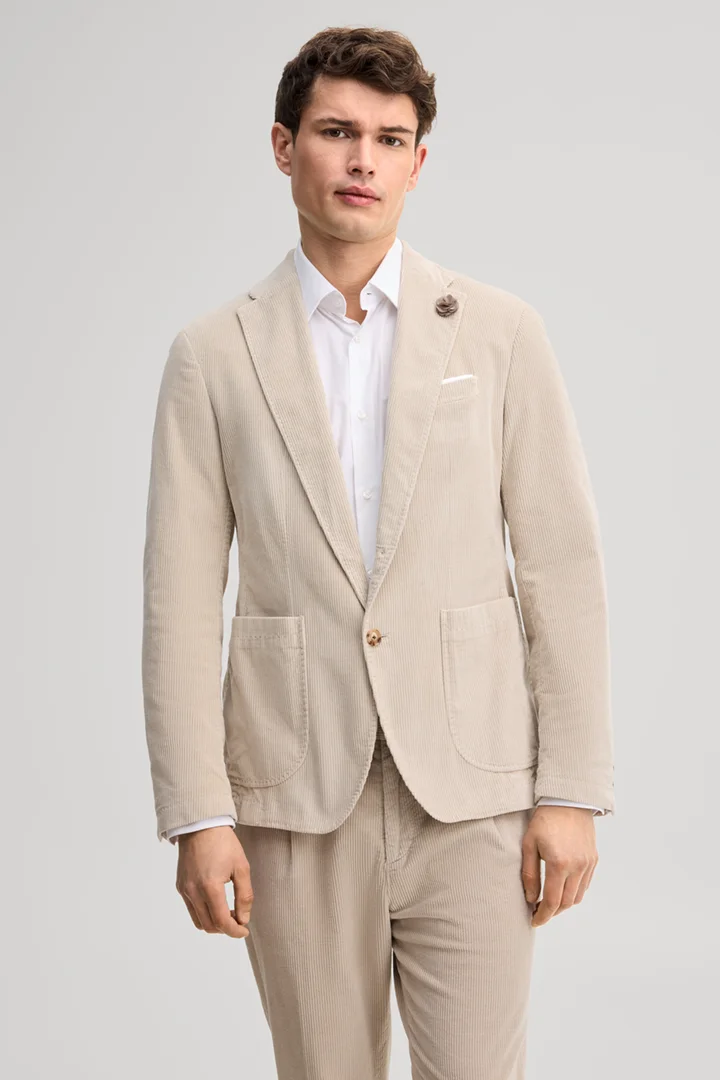 Leads to product detail page "Light beige corduroy suit jacket"