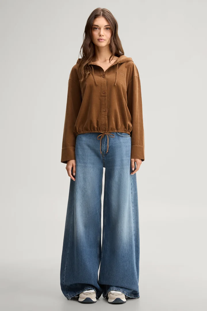 Leads to product detail page "Light brown corduroy blouse with a hood"