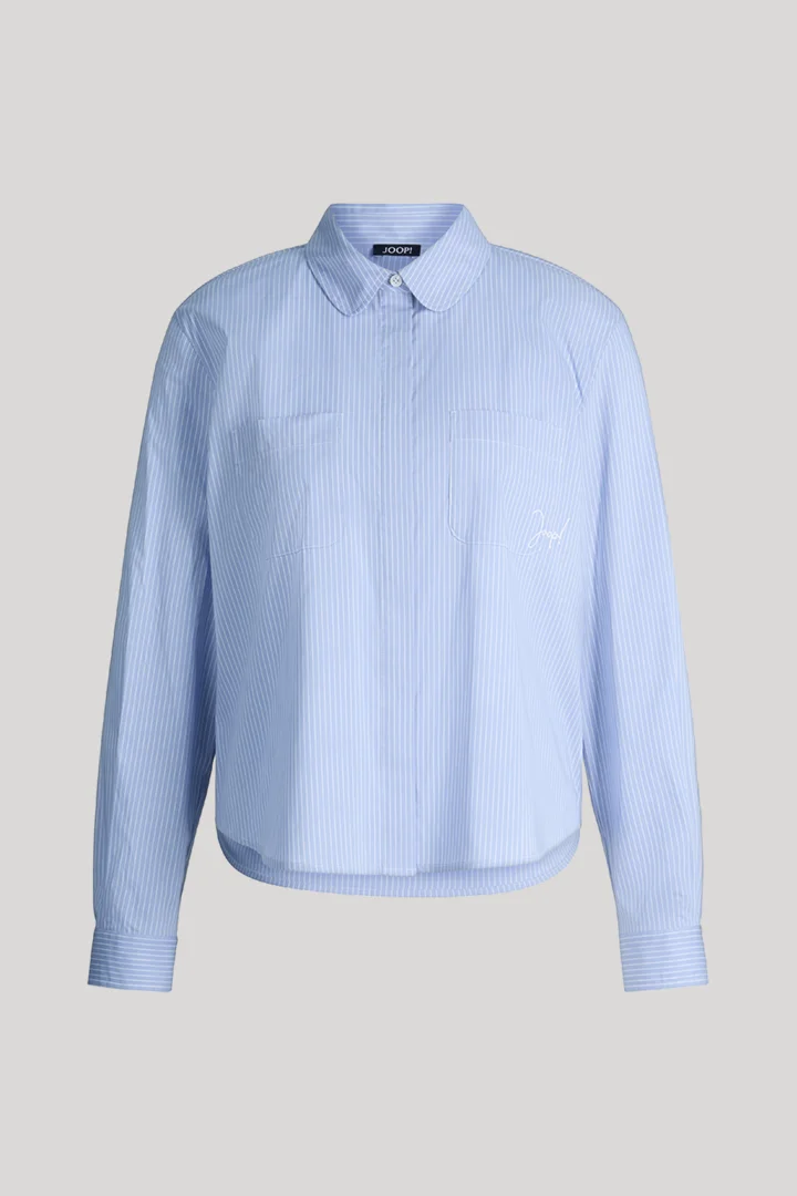 Leads to product detail page "Viscose-blend shirt in light blue and white stripes"