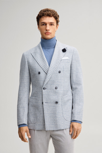 Leads to product detail page "Double-breasted suit jacket in a wool blend with a medium blue checked pattern"