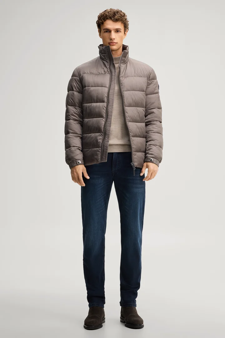Leads to product detail page "Quilted jacket with a stand-up collar in taupe"
