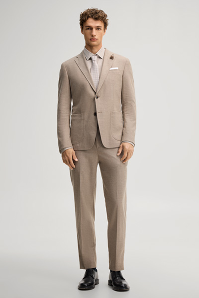 Leads to product detail page "Beige wool-blend suit jacket"