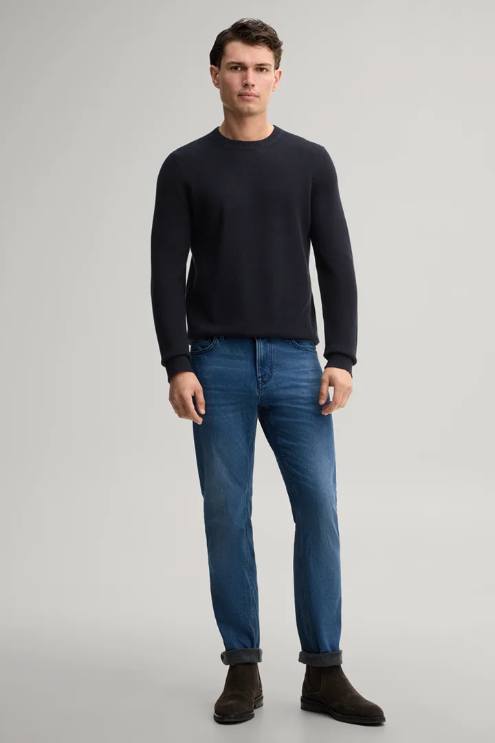 Leads to product detail page "Blue stretch five-pocket jeans"