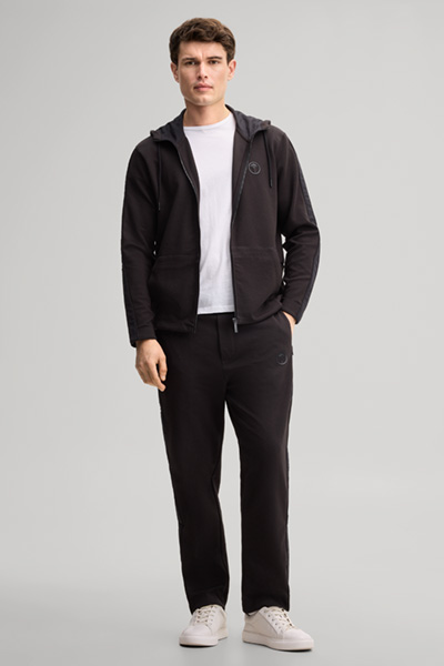Leads to product detail page "Black tracksuit bottoms"