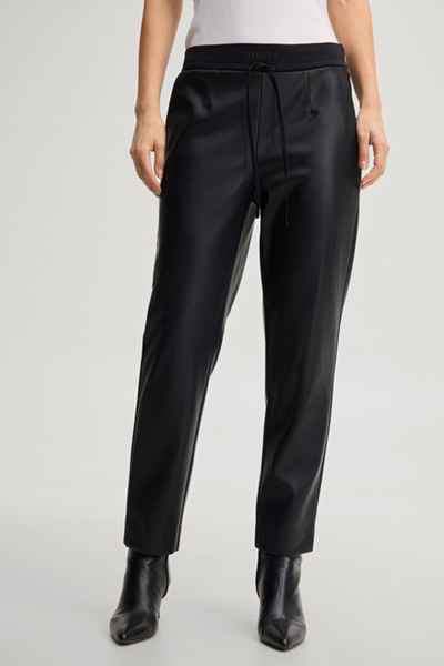 Leads to product detail page "Faux leather cigarette trousers in black"