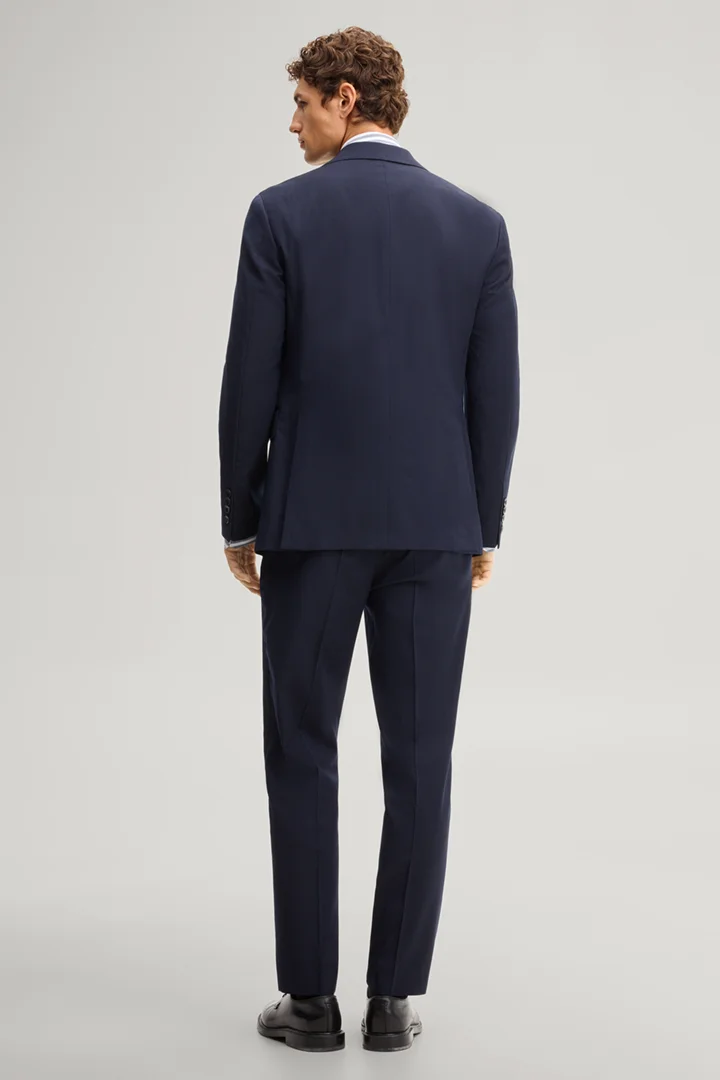 Leads to product detail page "Navy wool-blend suit"