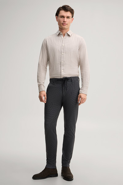 Leads to product detail page "Patterned viscose-blend chinos in anthracite"