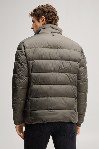 Leads to product detail page "Quilted jacket with a stand-up collar in dark green"