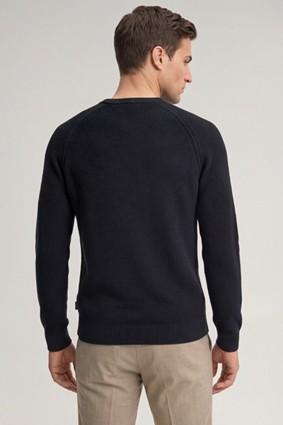 Leads to product detail page "Navy cotton crew-neck jumper"