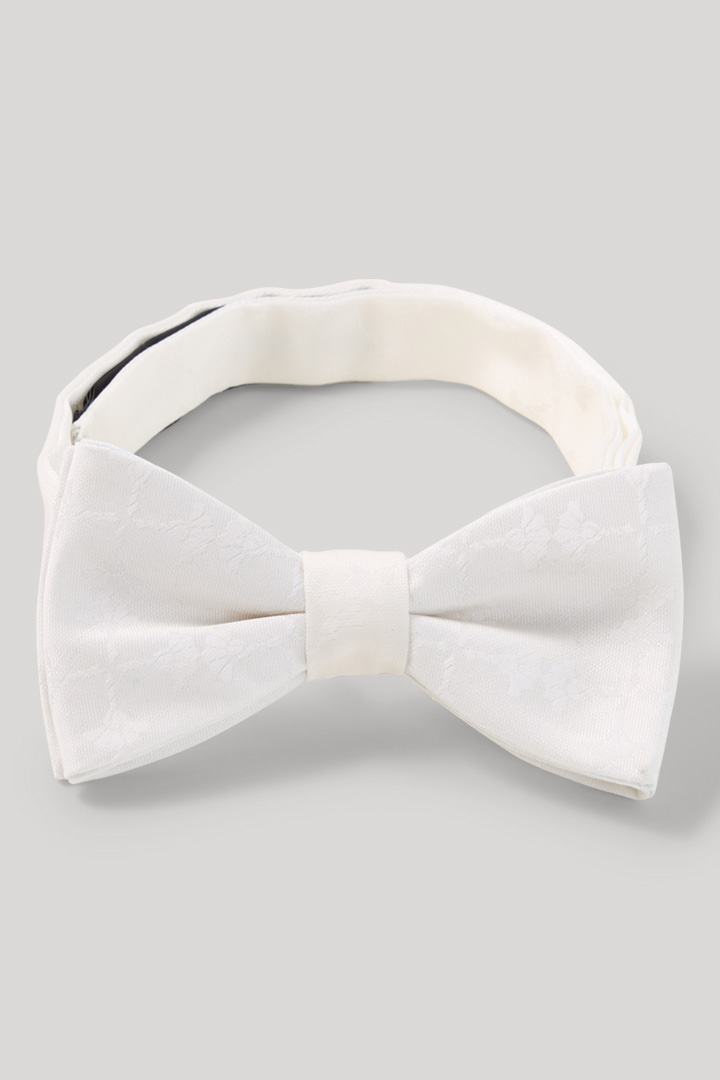 Führt zu Produktdetailseite „Fliege in Offwhite"