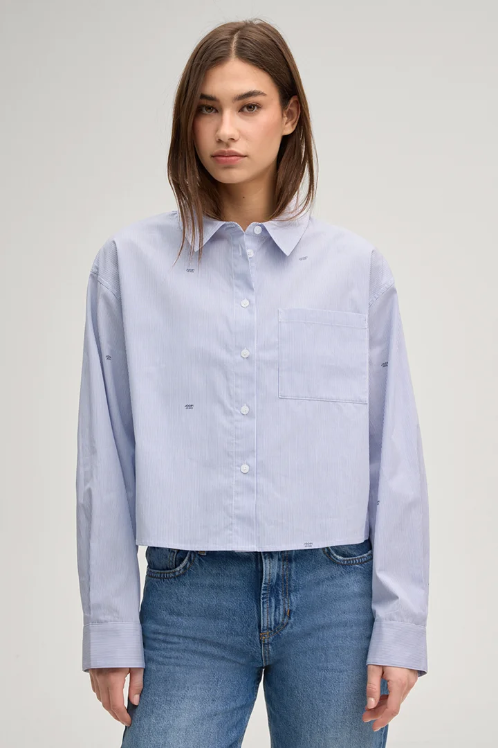 Leads to product detail page "Basima shirt blouse in blue/white stripes"