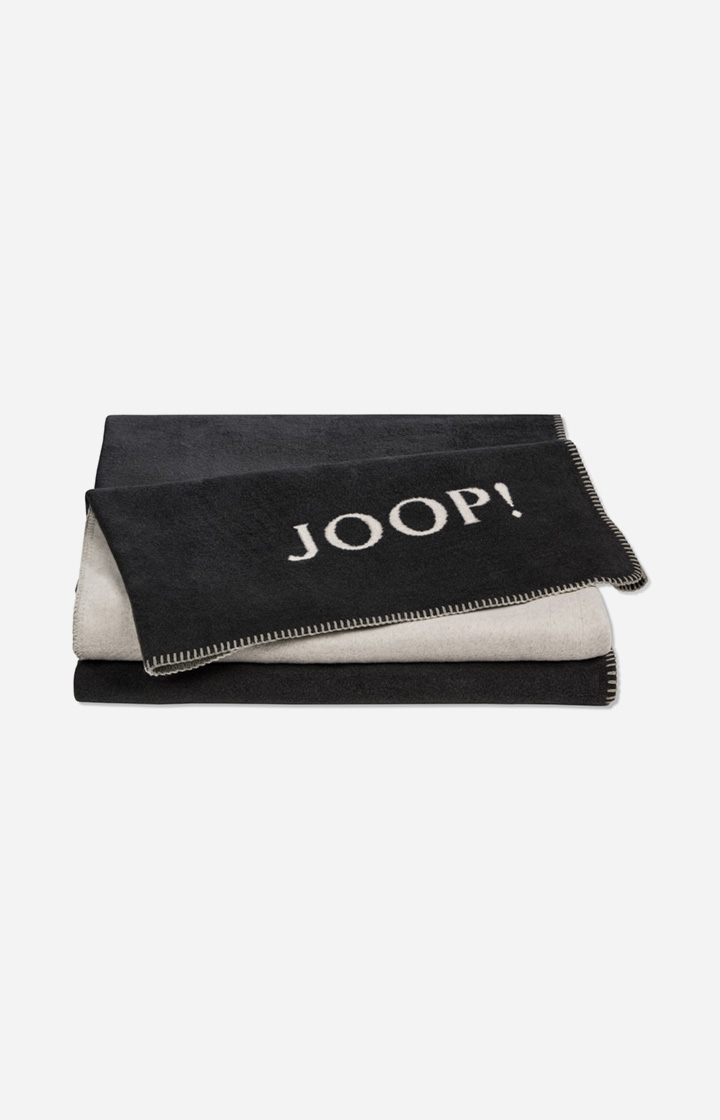 Leads to product detail page "JOOP! UNI DOUBLEFACE Blanket in Anthracite"