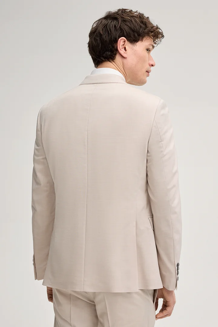 Leads to product detail page "Herby Modular Wedding Jacket in Light Beige"