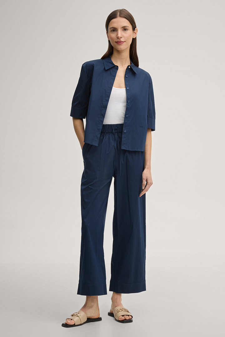 Leads to product detail page "Paloma Fabric Slacks in Dark Blue"