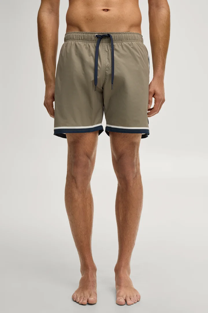 Leads to product detail page "Swimming shorts in olive green"