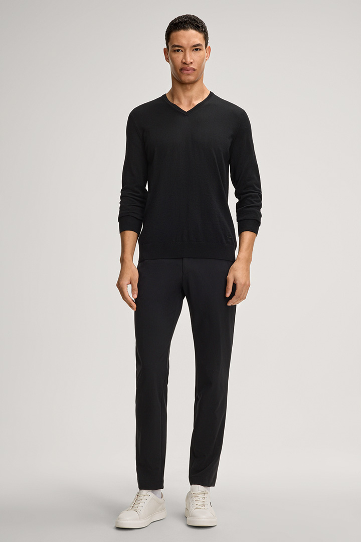 Leads to product detail page "Damien Merino Wool Jumper in Black"