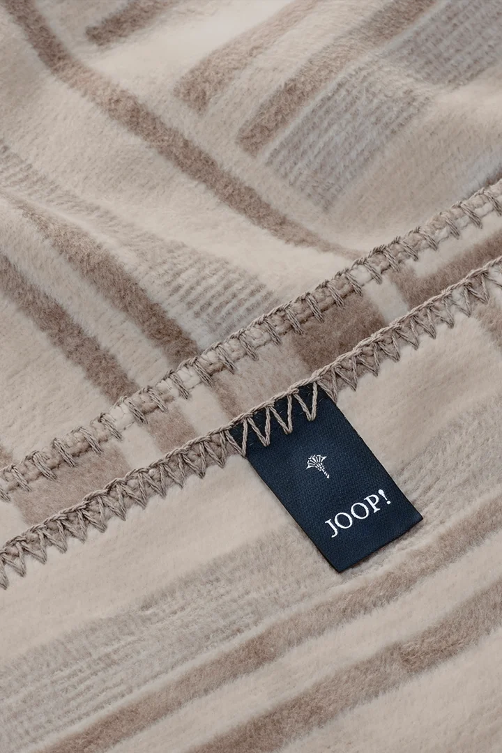 Führt zu Produktdetailseite „JOOP! WEAVE Wohndecke 150x200 cm, sand"