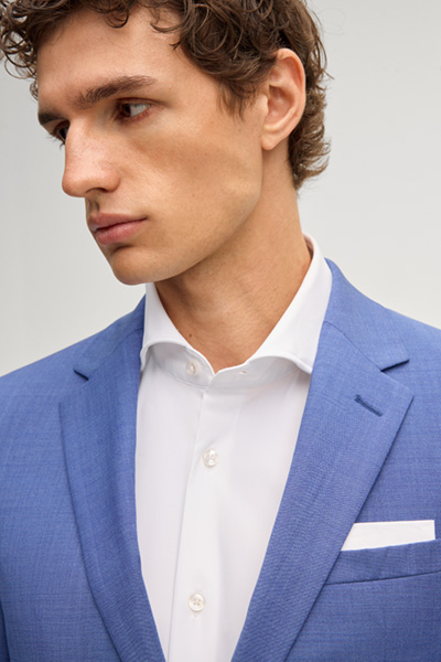 Leads to product detail page "Damon-Gun suit in mid-blue"