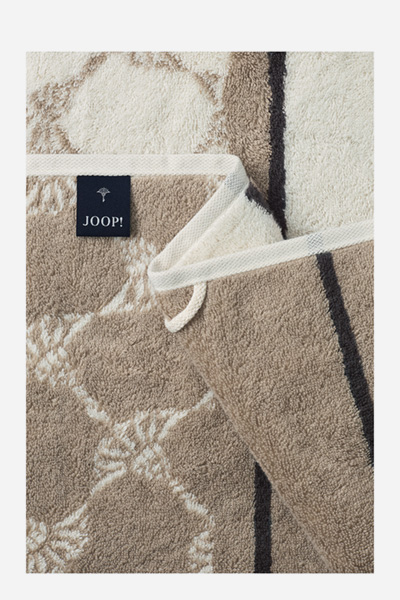 Leads to product detail page "Joop! sauna shower towel in cream and light brown with a pattern"