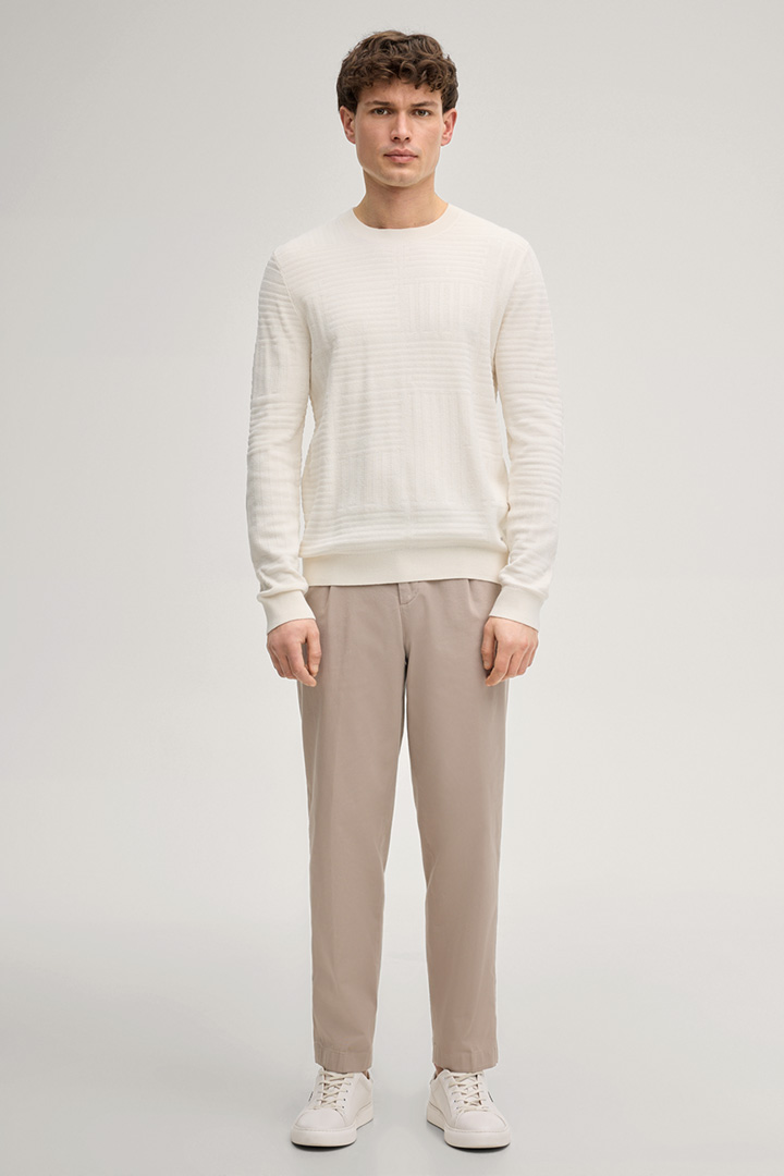 Leads to product detail page "Raikon Jumper in Off-white"