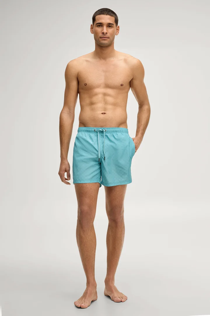 Leads to product detail page "Swim shorts in turquoise cornflower"