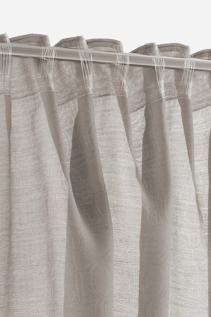 Leads to product detail page "New JOOP! ORNAMENT ALLOVER ready-made drapes in umber"