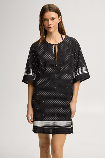 Leads to product detail page "Beach dress Brismar Beach in black and white polka dots"