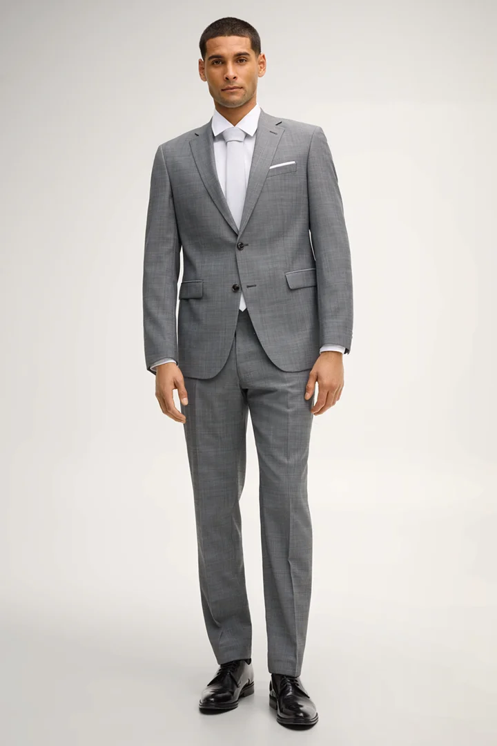 Leads to product detail page "Brad Modular Suit Trousers in Grey Textured"
