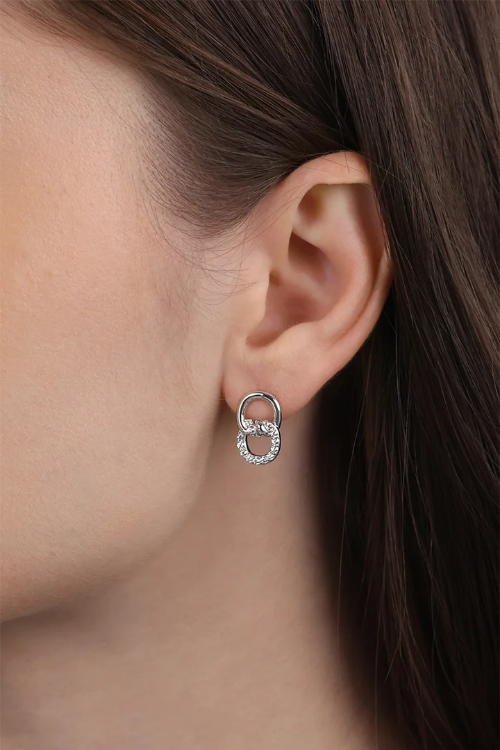 Leads to product detail page "Silver stud earrings with cubic zirconia"