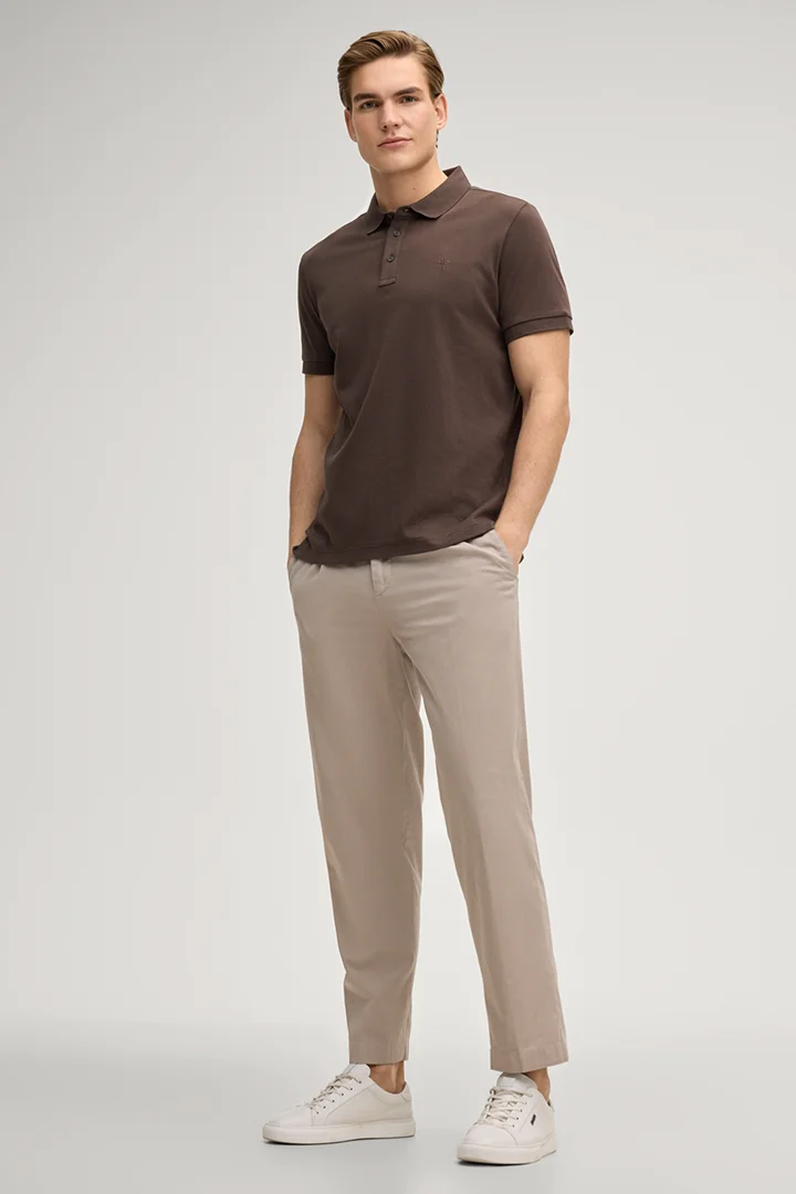 Leads to product detail page "Primo polo shirt in dark brown"