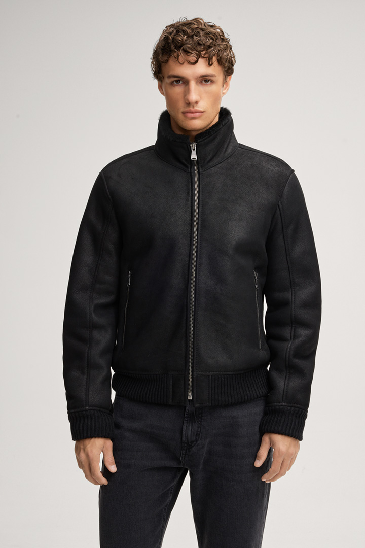 Leads to product detail page "Razor Shearling Leather Jacket in Black"