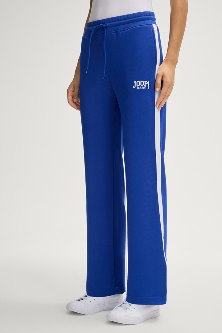 Leads to product detail page "Trine Jogging Pants in Royal Blue"