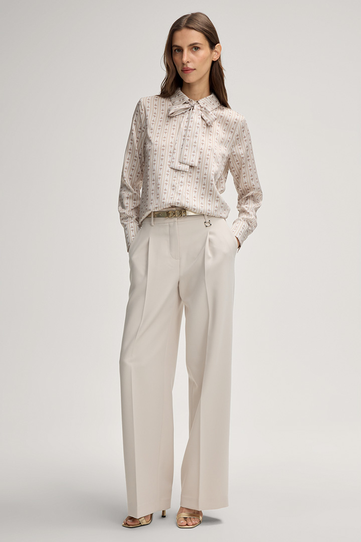 Leads to product detail page "Bernicia Blouse in a Beige Pattern"