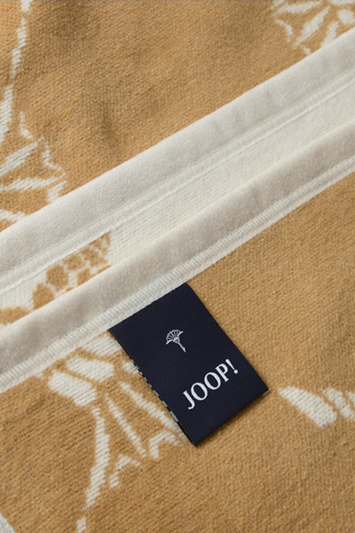 Führt zu Produktdetailseite „Wohndecke JOOP! OUTDOOR CORNFLOWER in Natur/Curry, 125 x 170 cm"