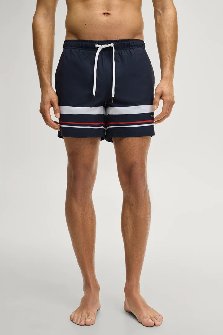 Leads to product detail page "Dark blue striped swim shorts"