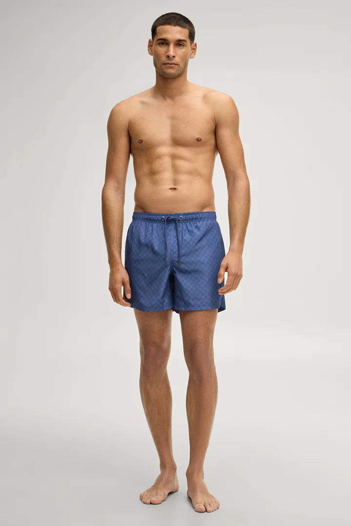 Leads to product detail page "Swim shorts in cornflower blue"